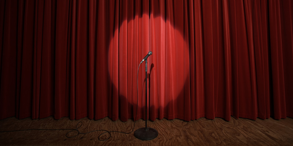 Spotlight on microphone stand on stage